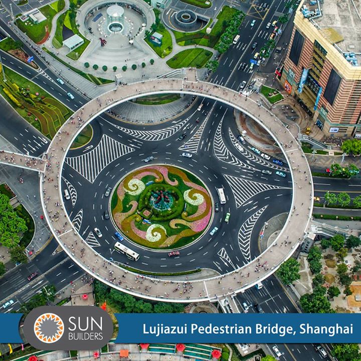 The Lujiazui pedestrian bridge in Shanghai has numerous escalator stairway entrances and exits helping the pedestrians enjoy the walkway for its privileged views of the city. #Amazing #Architecture