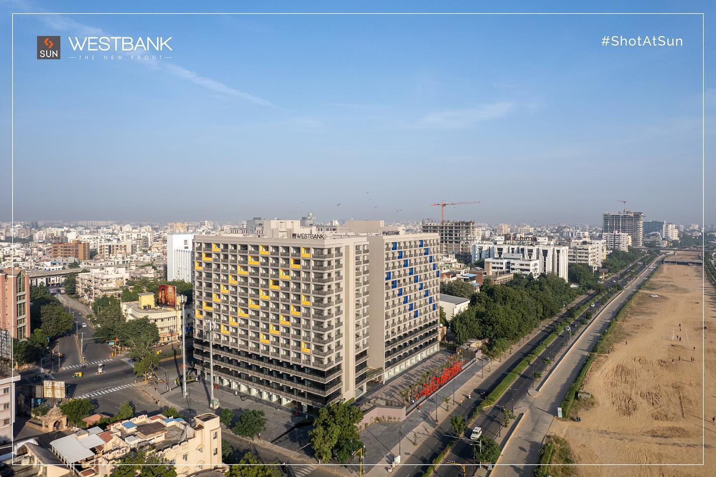 Sun Builders,  SunBuildersGroup, SunBuilders, SunWestBank, ShotAtSun, Commercial, Offices, Retail, AshramRoad, droneshots, aerial, aerialview, RiverFront, PossessionReady, BuildingCommunities, SmartInvestment, RealEstateAhmedabad, helloahmedabad
